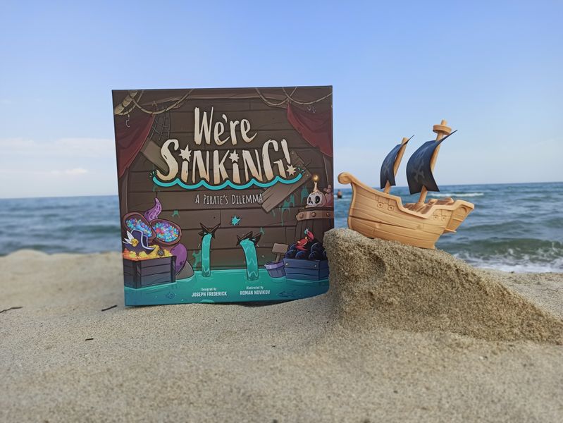 We're Sinking! game box beside the assembled ship