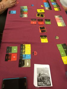 Four player game of Yardmaster with trains and cargo cards