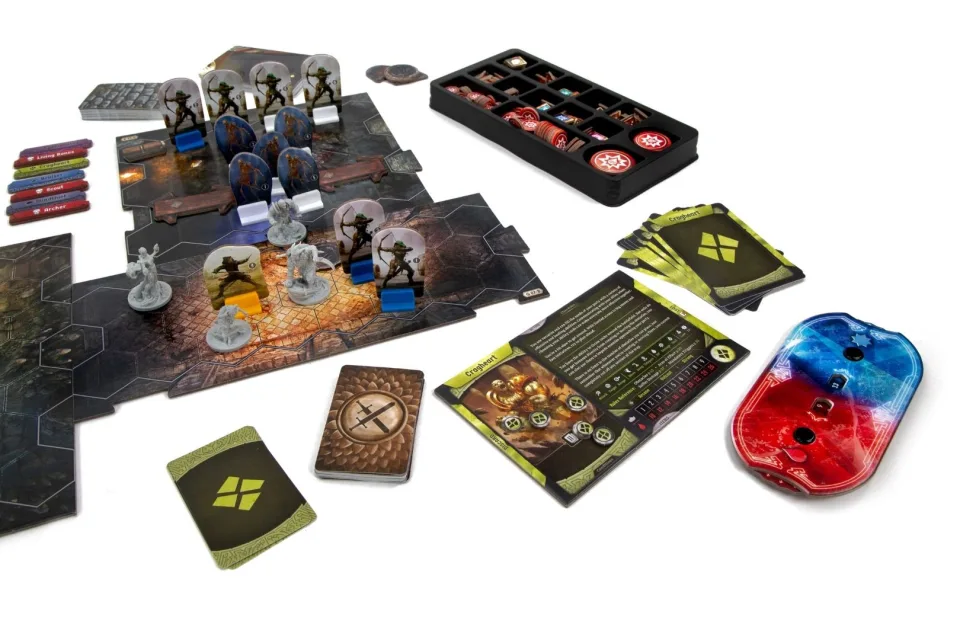 Gloomhaven scenario set up with map tiles, miniatures, monster standees, cards, and trackers