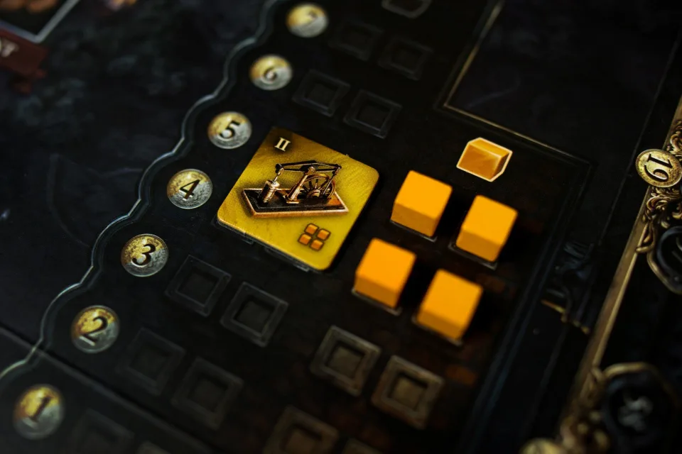 Yellow Brass: Birmingham player mat with an industry tile, iron cubes, and development track