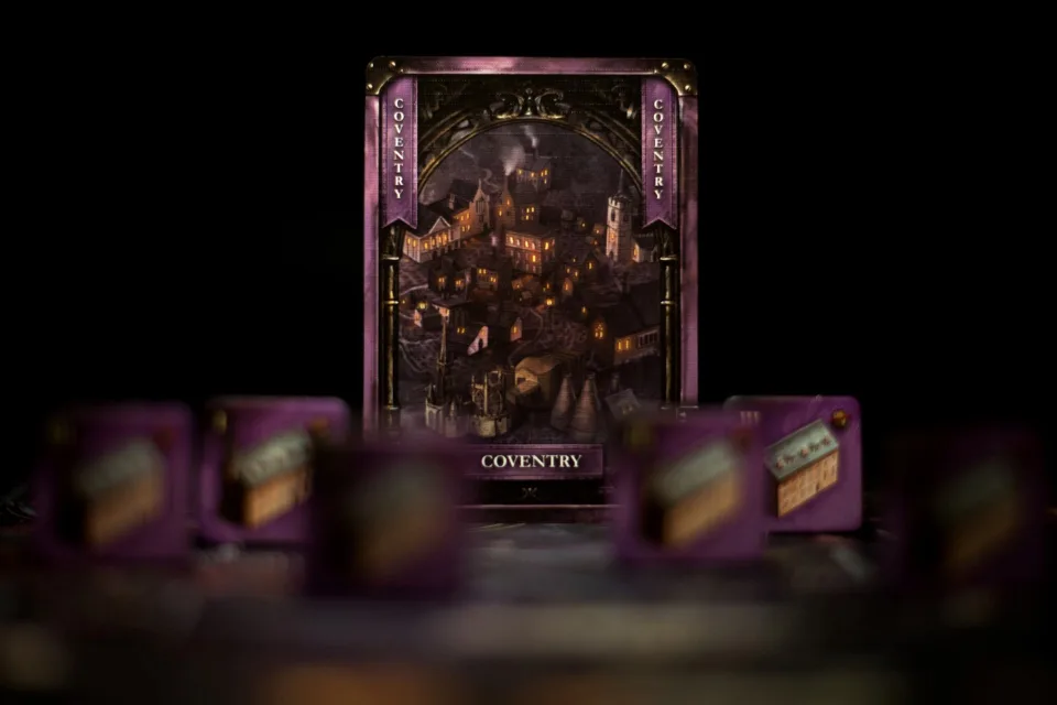 Coventry location card standing behind purple Brass: Birmingham industry tiles