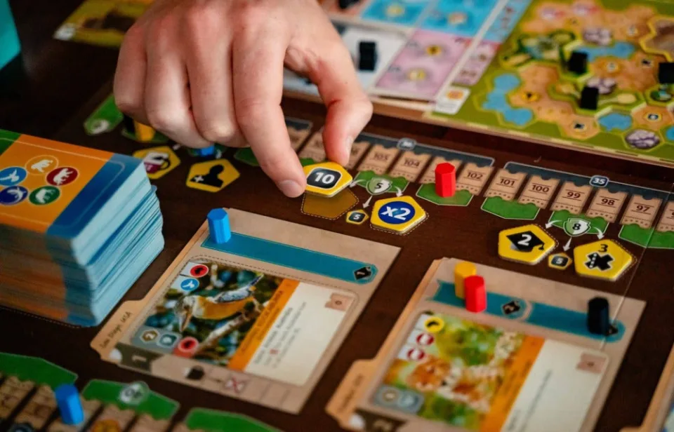 Ark Nova player mat with five action cards beside the personal zoo map