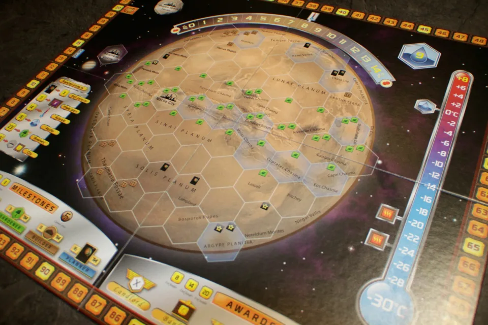 Terraforming Mars board with city, greenery, ocean tiles, and global parameter tracks in play