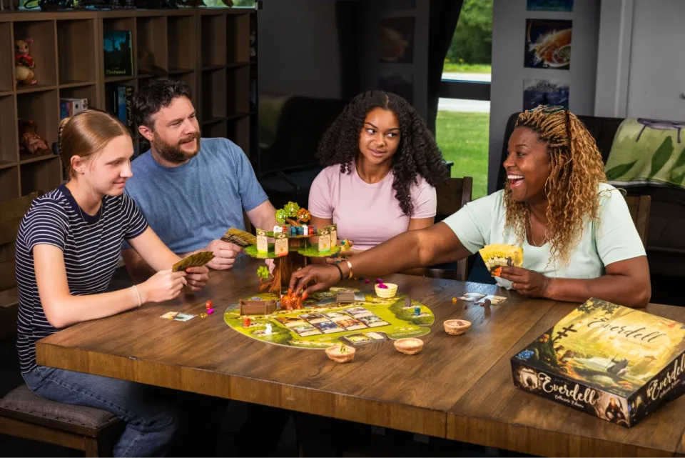 Players playing Everdell at a table