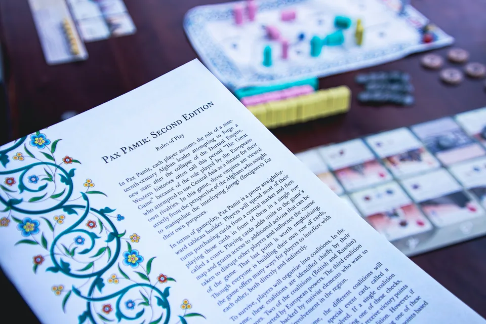 Pax Pamir Second Edition rulebook with game setup