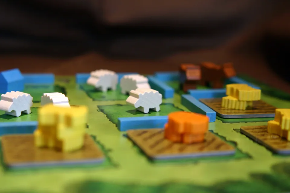 Wooden resource pieces from Agricola Revised Edition.