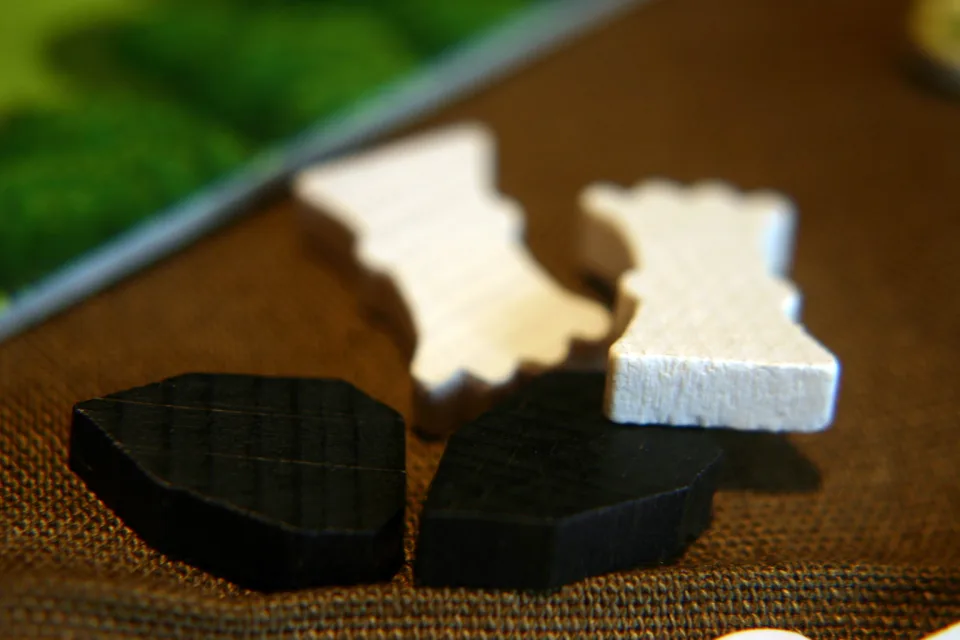 Wooden animal and resource pieces from Agricola.