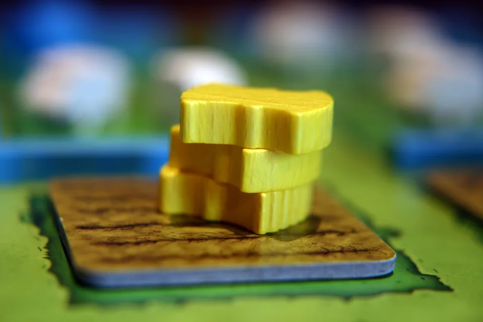 Agricola cards arranged beside action spaces.
