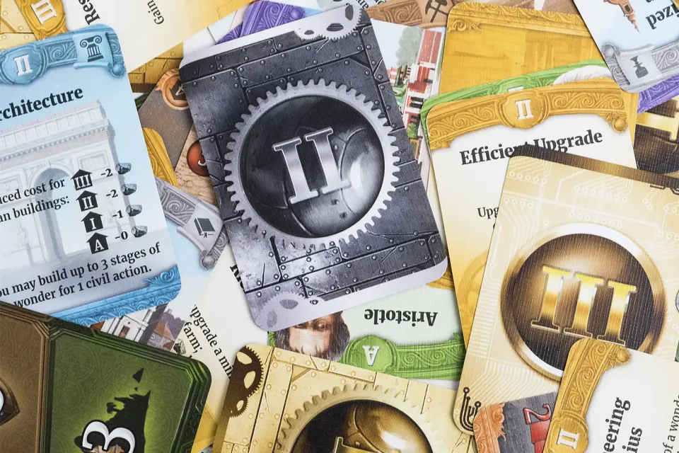 Through the Ages civilization cards and board elements.