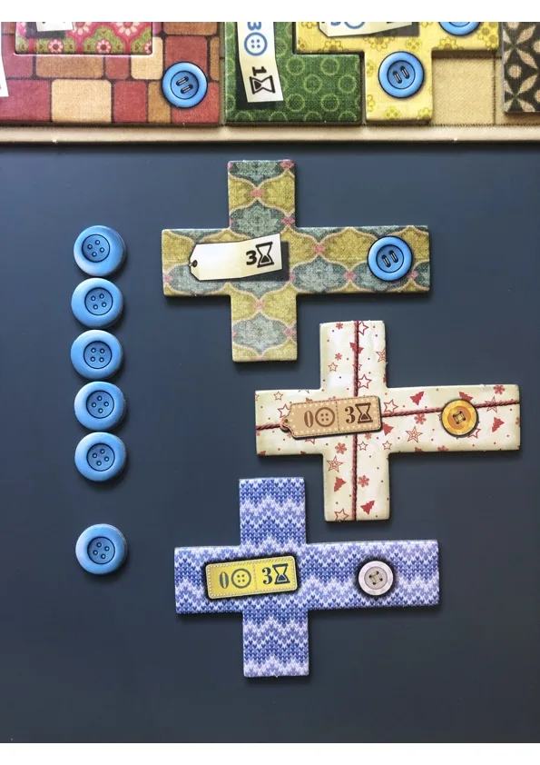 Patchwork player quilt board with patch pieces and buttons.