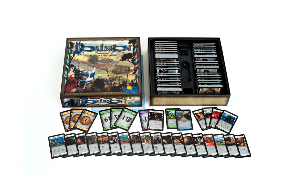 Dominion open box with stacks of base-game cards.