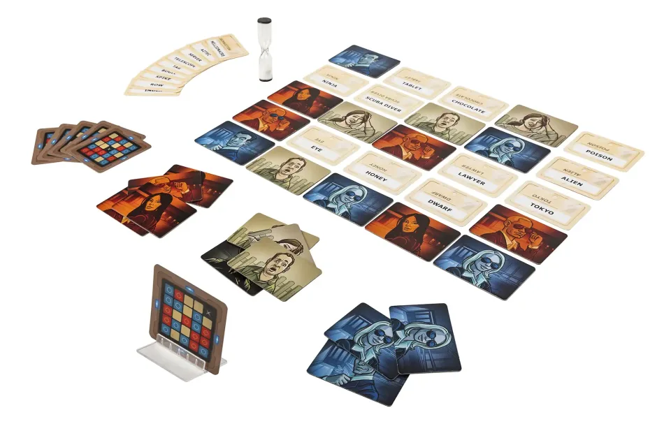 Close view of Codenames word cards and player hands.