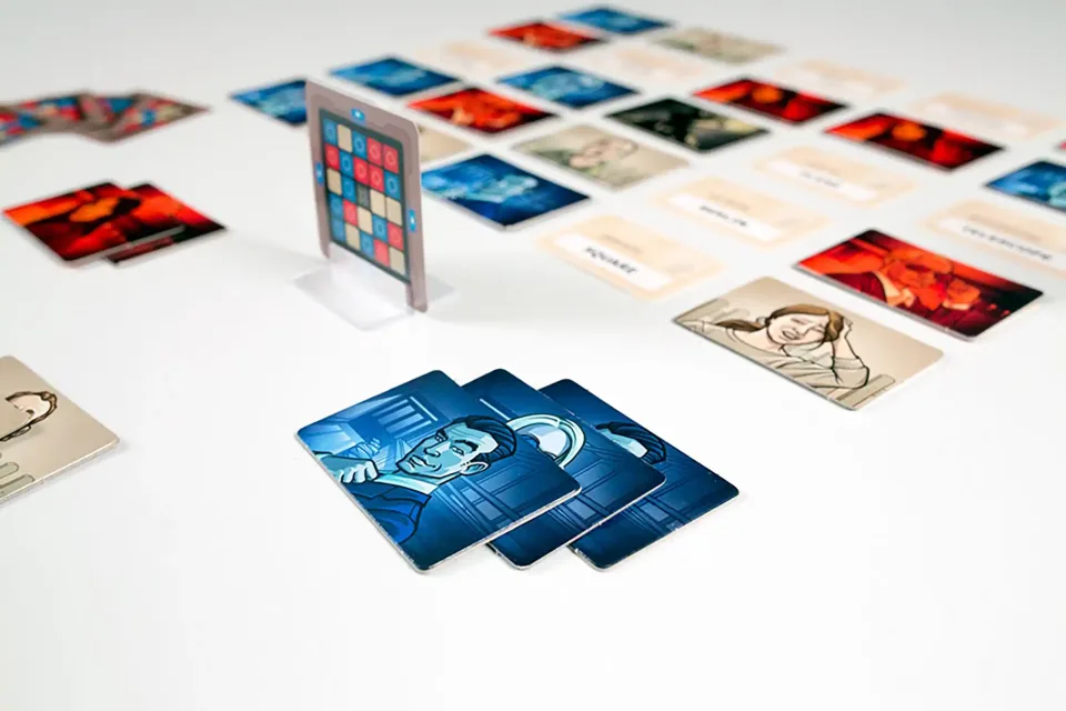 Codenames agent cards arranged beside word cards.