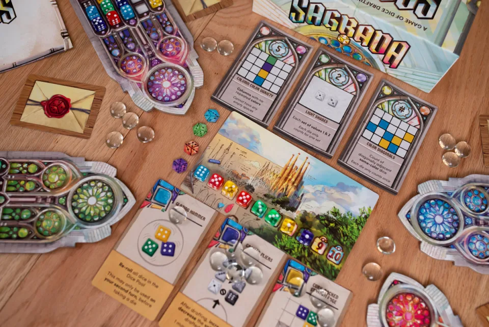 Sagrada player windows and colorful dice set up on a table.