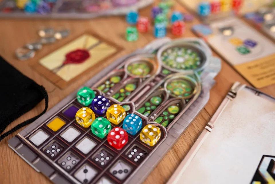 Sagrada player board with colorful drafted dice.