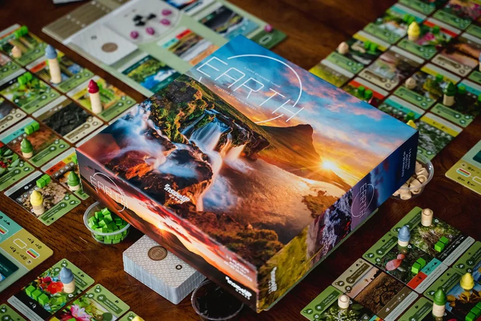 Earth board game set up on a table.