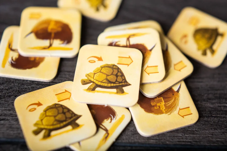Near and Far illustrated travel tokens in a component close-up.