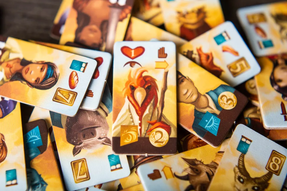 Close-up of illustrated adventurer cards from Near and Far.