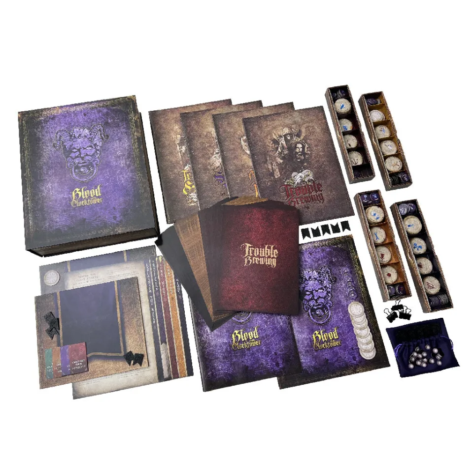 Blood on the Clocktower base-game tokens, rulebook, and Trouble Brewing materials.