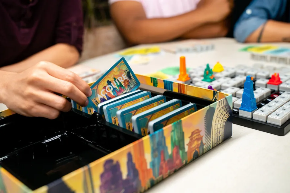 Acquire built-in component tray with stock cards and headquarters buildings