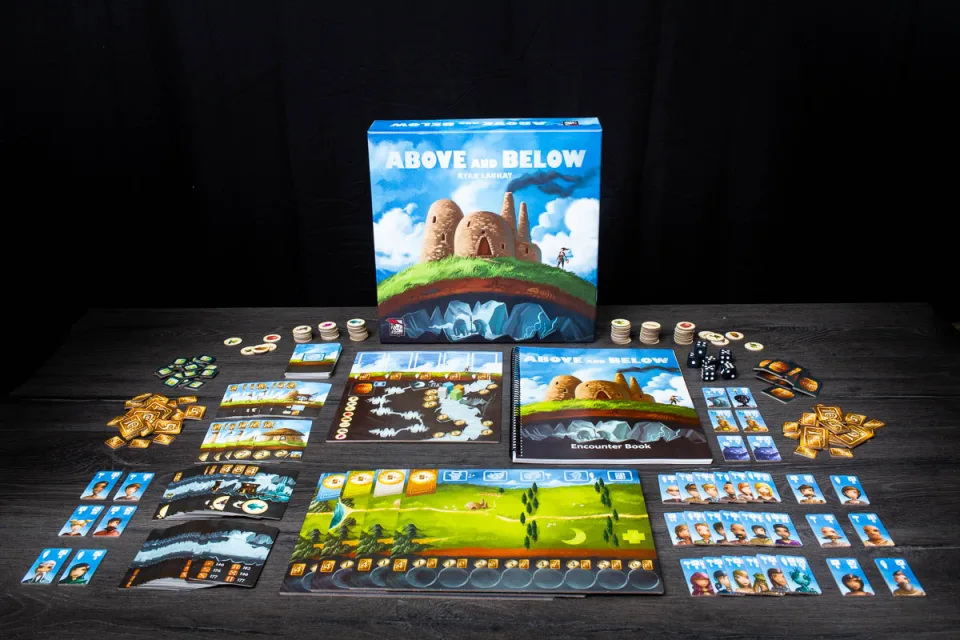 Above and Below base-game components laid out with box and encounter book