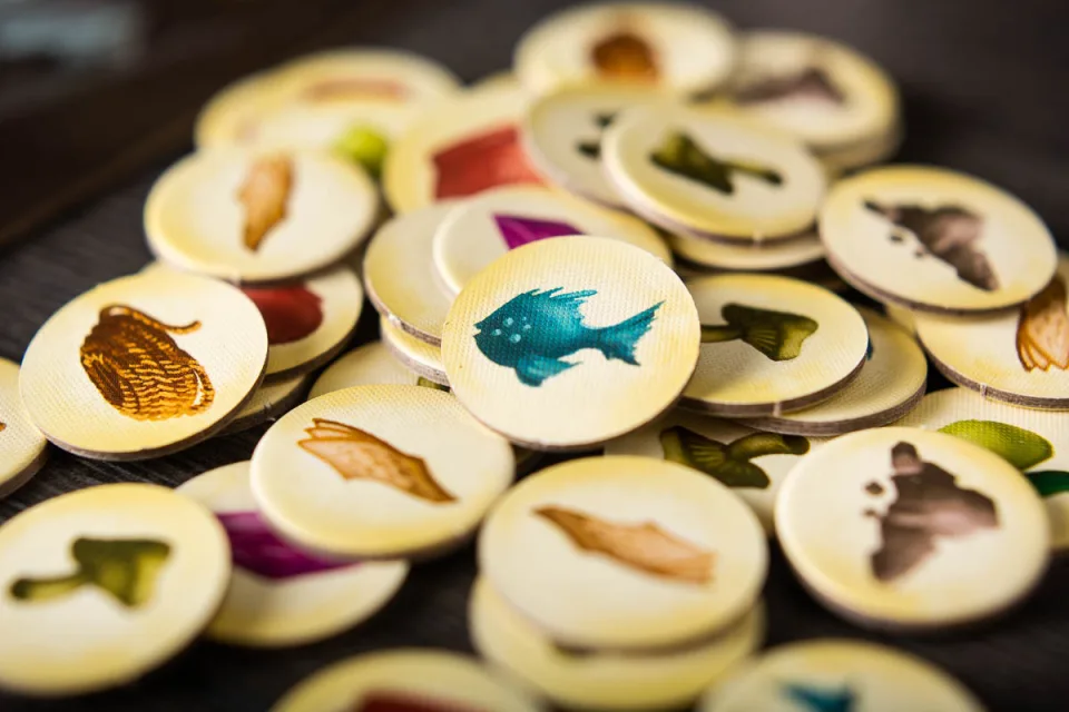 Above and Below wooden resource tokens
