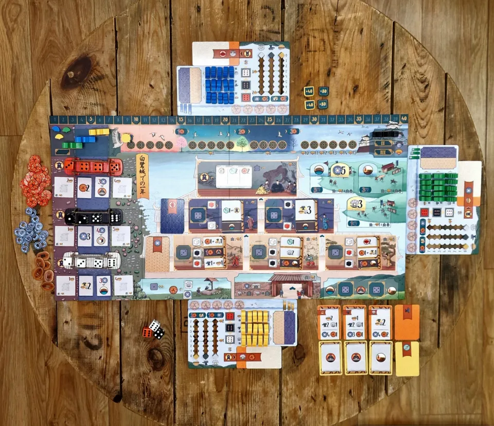The White Castle full game setup with board, dice, and player areas